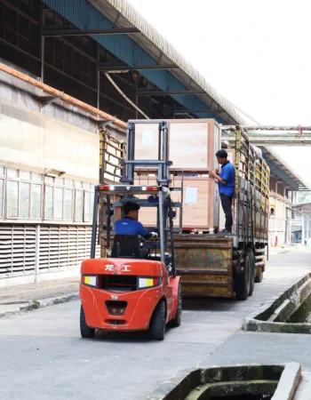 Retail display shipping process using a forklift loading into a logistics truck at a factory in Indonesia