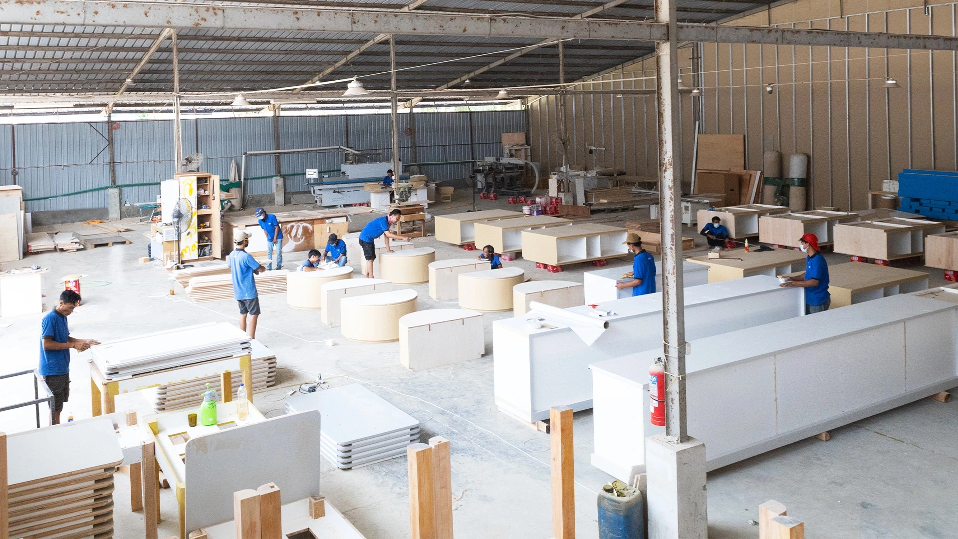 Retail display manufacturing process in factory workshop woodworking workers